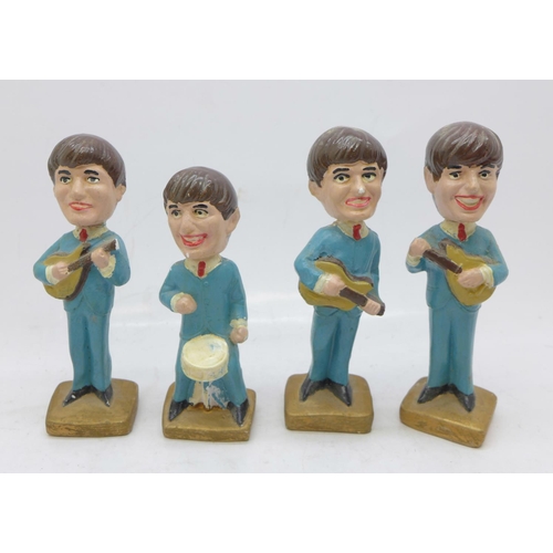 839 - The Beatles set of four plaster model miniatures, 1960's