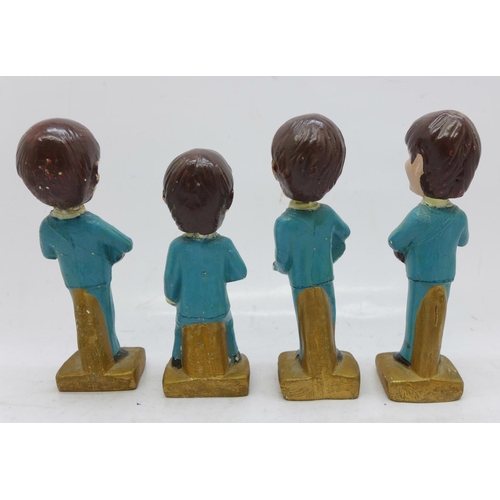 839 - The Beatles set of four plaster model miniatures, 1960's