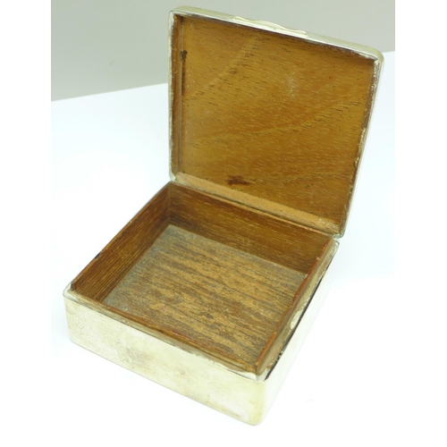 850 - A silver cigarette box, with monogram, 8cm, weight including liner 159g