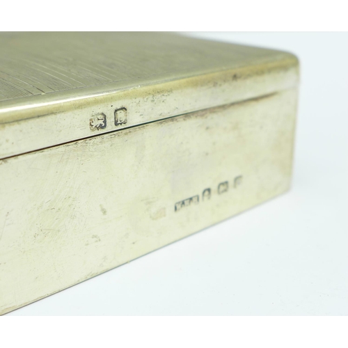 850 - A silver cigarette box, with monogram, 8cm, weight including liner 159g