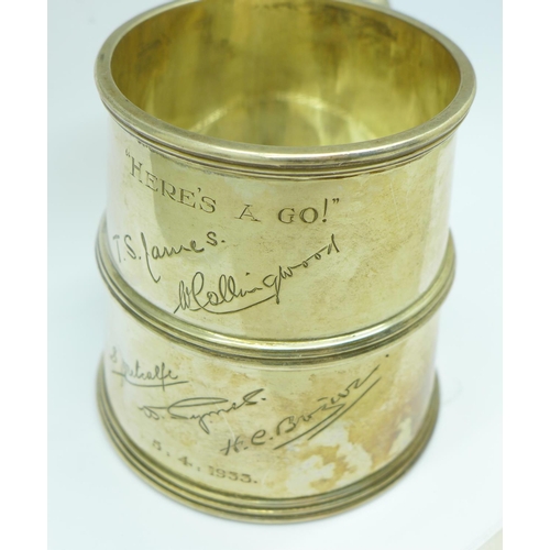 853 - A silver mug, with inscription signatures dated 1933, slight dent, 236g