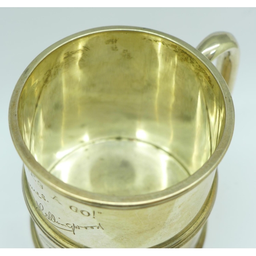 853 - A silver mug, with inscription signatures dated 1933, slight dent, 236g