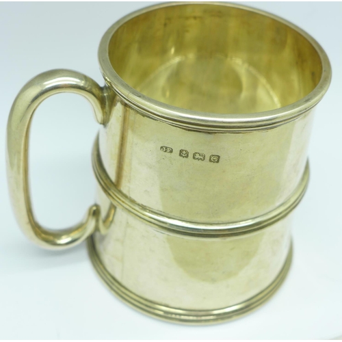 853 - A silver mug, with inscription signatures dated 1933, slight dent, 236g
