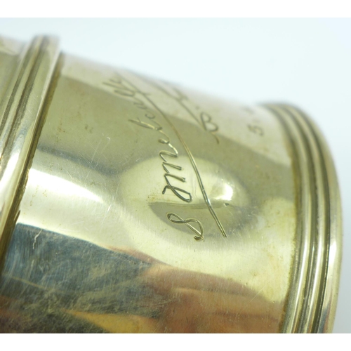 853 - A silver mug, with inscription signatures dated 1933, slight dent, 236g