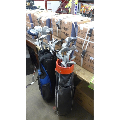 2383 - 2 Golf bags Dunlop and tiger shark containing qty of drivers 1/3/5/7 irons with 3 putters