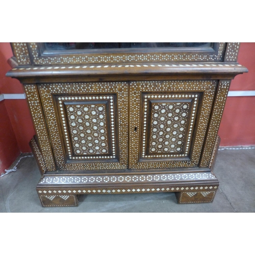 60 - A Moorish inlaid mahogany splay front side cabinet