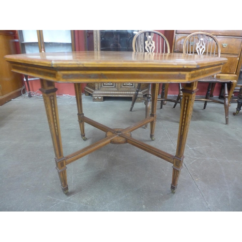 83 - A Victorian Sheraton Revival inlaid satinwood octagonal centre table