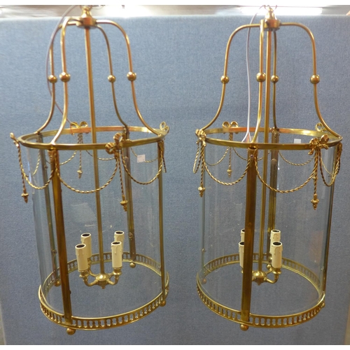 94 - A pair of French style gilt metal cylindrical hanging ceiling lanterns