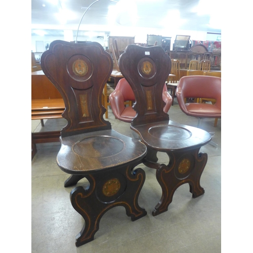 96 - A pair of 19th Century painted armorial mahogany chairs