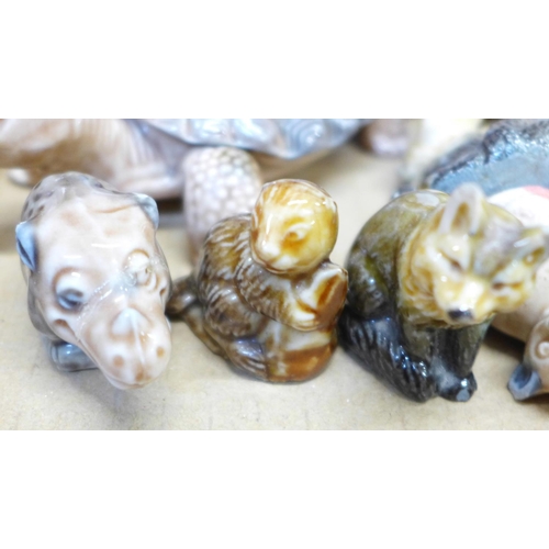 691 - A collection of Wade Whimsies and thimbles