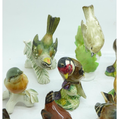 694 - A collection of bird figures including Beswick, Royal Worcester, Goebel, etc., some a/f