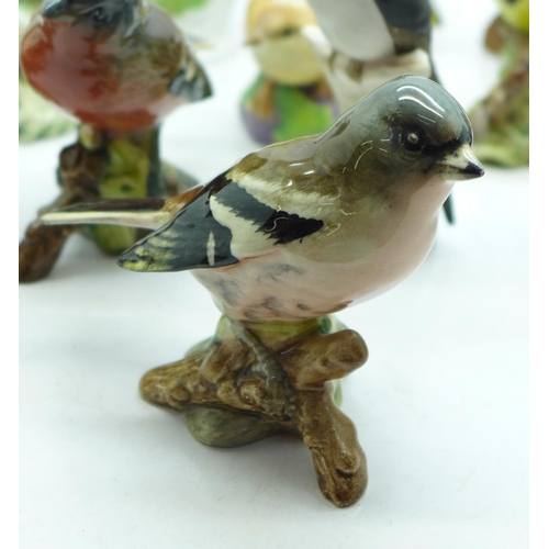 694 - A collection of bird figures including Beswick, Royal Worcester, Goebel, etc., some a/f