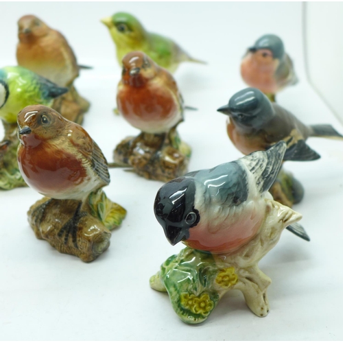 694 - A collection of bird figures including Beswick, Royal Worcester, Goebel, etc., some a/f