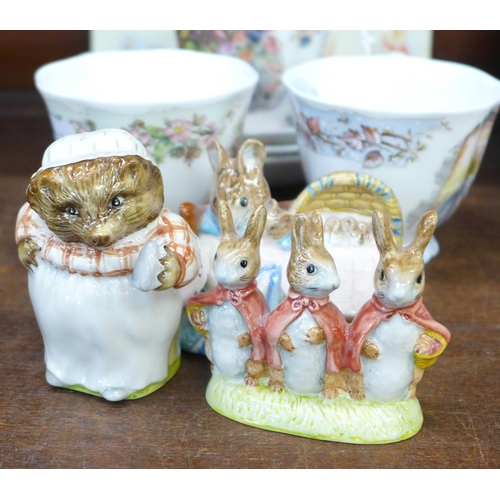 696 - Three Royal Albert Beatrix Potter figures, three Royal Doulton cups and saucers and a christening pl... 