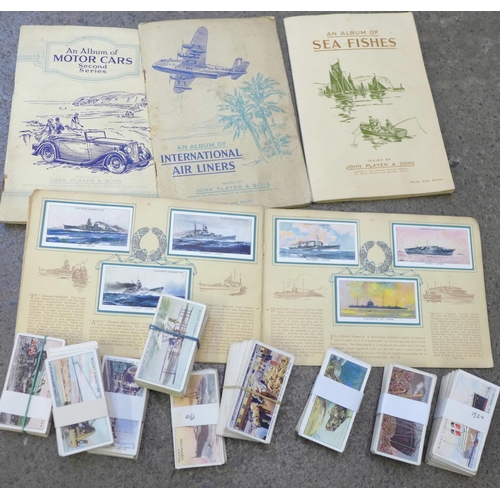 701 - Nine sets of loose cigarette cards and four sets in albums including Wills Celebrated Ships and The ... 