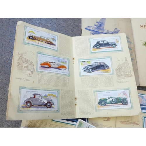 701 - Nine sets of loose cigarette cards and four sets in albums including Wills Celebrated Ships and The ... 