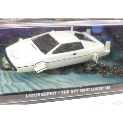 703 - Six model vehicles;- four by Corgi, Land Rover, TR7, Mini limited edition, James Bond Thunderball DB... 