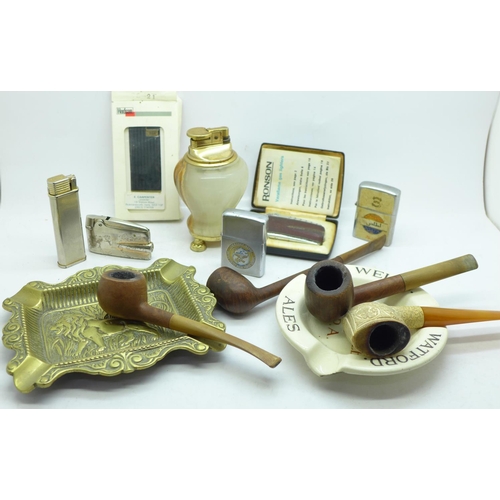 707 - A collection of pipes, cigarette lighters, etc.