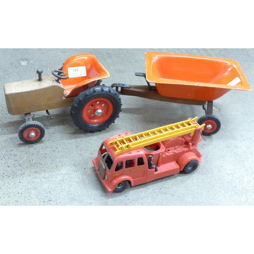 720 - A vintage toy tractor with trailer and a Tri-ang Minic fire engine