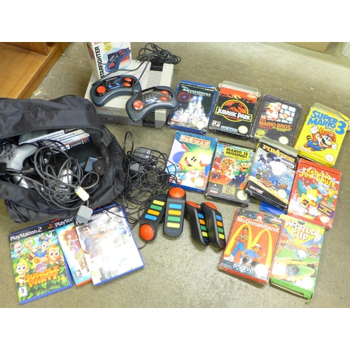 771 - A Nintendo Entertainment System, NES Version, with ten games, a PS2 with seven games and a Smart Sta... 