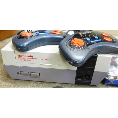 771 - A Nintendo Entertainment System, NES Version, with ten games, a PS2 with seven games and a Smart Sta... 