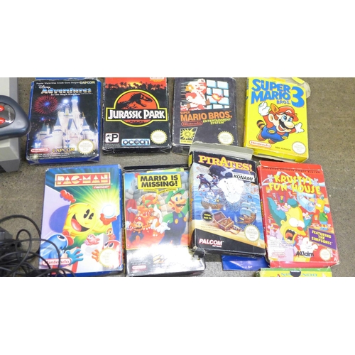 771 - A Nintendo Entertainment System, NES Version, with ten games, a PS2 with seven games and a Smart Sta... 