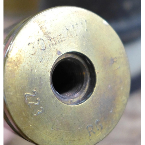 808 - A '25 pounder' military shell case marked 1955, one similar 30mm shell case, a brass drill round bas... 