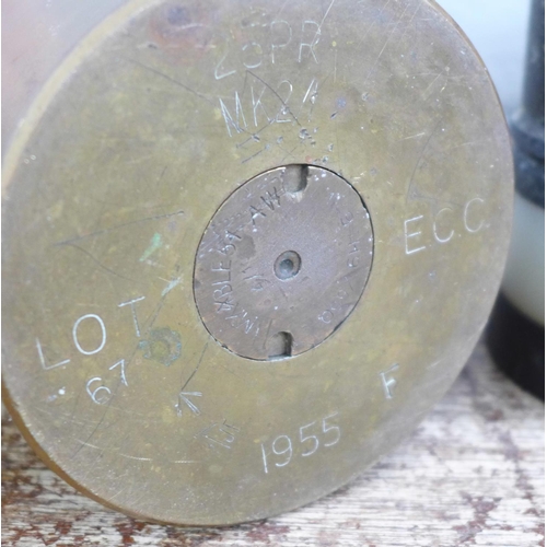 808 - A '25 pounder' military shell case marked 1955, one similar 30mm shell case, a brass drill round bas... 