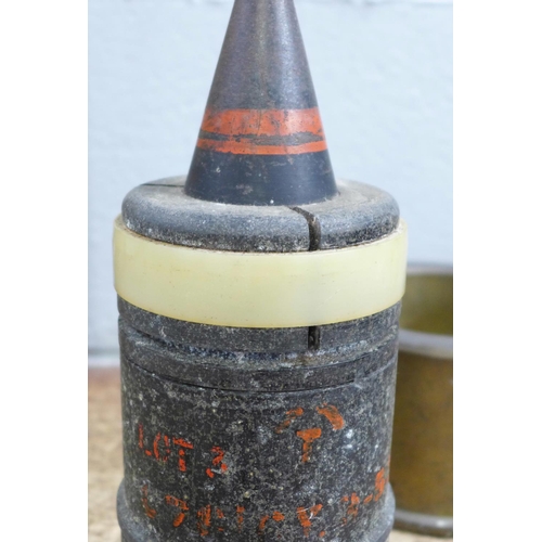 808 - A '25 pounder' military shell case marked 1955, one similar 30mm shell case, a brass drill round bas... 