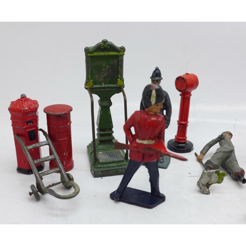 826 - A collection of Britains lead figures, etc., including policemen, railway, military and post boxes