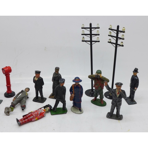 826 - A collection of Britains lead figures, etc., including policemen, railway, military and post boxes