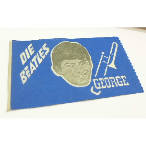 834 - A Beatles 1960's jigsaw and a small George Harrison flag