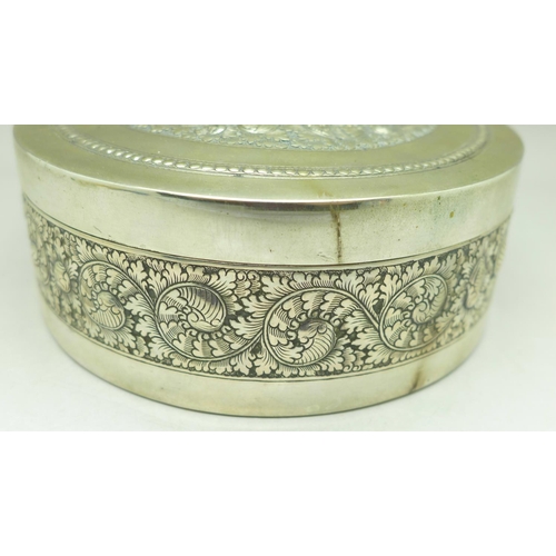 851 - A circular white metal box with wood liner, marked Argent 900, diameter 12cm