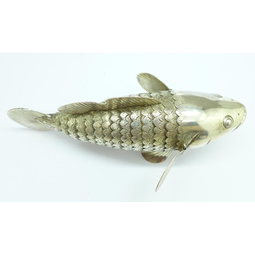 859 - A novelty articulated model of a fish, marked T90, 14cm