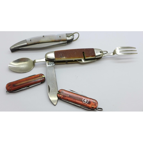 873 - Two Victorinox knives, a multi-tool camping knife marked Ireland and one other, (4)