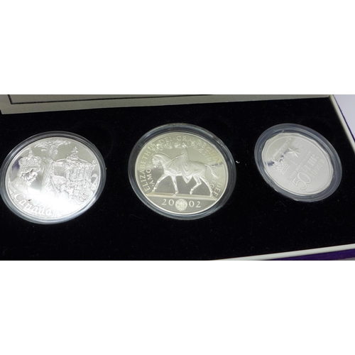 893 - The Accession silver three coin set, boxed, Royal Canadian Mint, Royal Mint and Royal Australian Min... 