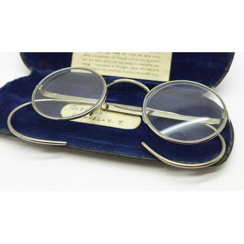 895 - A pair of 1940's WWII spectacles, worn inside a respirator, cased