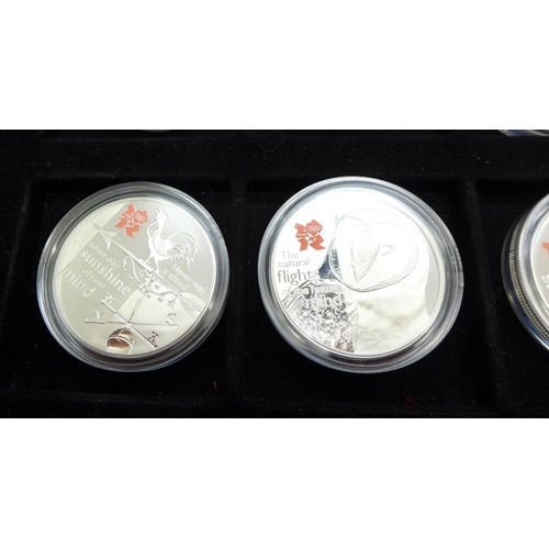 960b - A set of twelve The Royal Mint 2012 A Celebration of Britain .925 silver £5 proof coins, cased