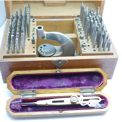 705 - A watch staking tool and one other cased tool