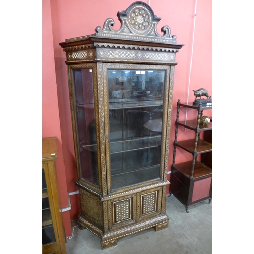 60 - A Moorish inlaid mahogany splay front side cabinet