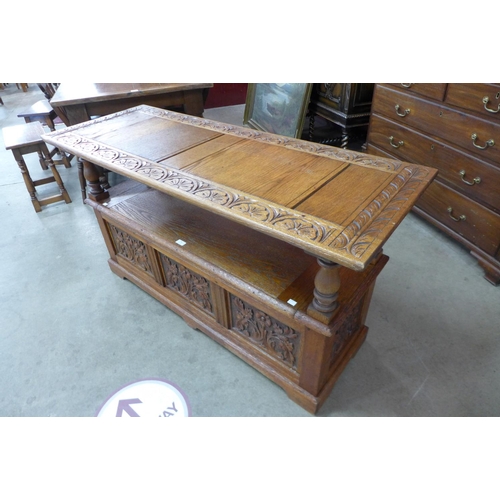 76 - An Elizabethan Revival carved oak monks bench