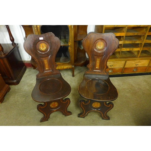 96 - A pair of 19th Century painted armorial mahogany chairs