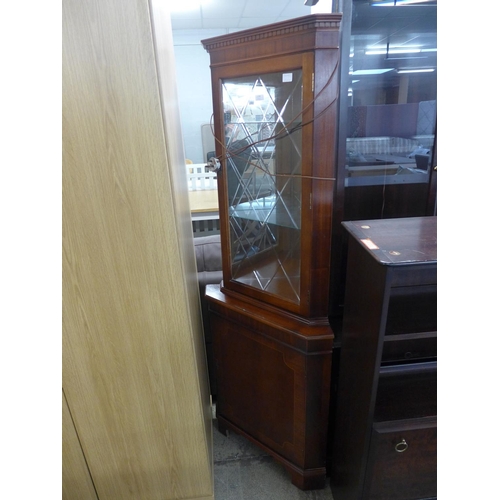 1827 - A reproduction mahogany mirror back floor standing corner display cabinet