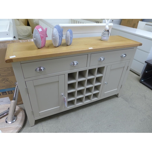 1825 - An oak and stone sideboard with wine rack - damaged back leg   *This lot is subject to VAT