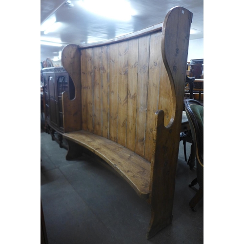 192 - A 19th Century style pine bacon settle