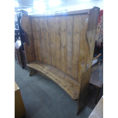 192 - A 19th Century style pine bacon settle