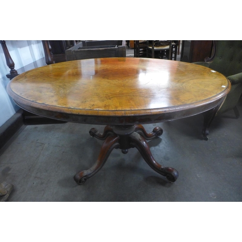 208 - A Victorian walnut oval tilt top breakfast table