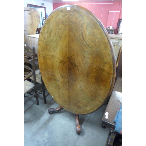 208 - A Victorian walnut oval tilt top breakfast table