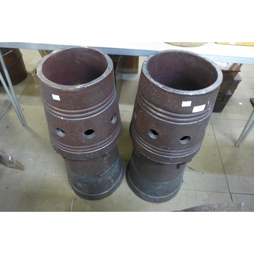 372 - A pair of glazed terracotta chimney pots