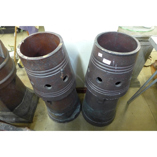 372 - A pair of glazed terracotta chimney pots